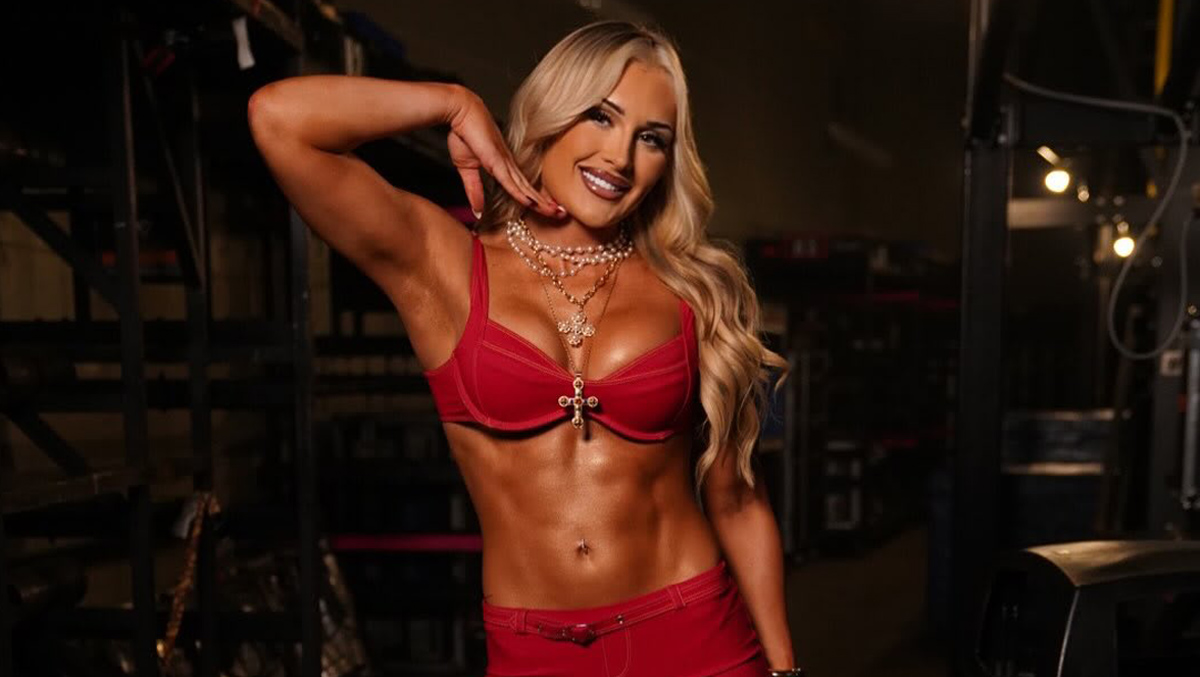 Sexy Tiffany Stratton popping her neck, flaunting her perfect body in a red bra and low-rise pants