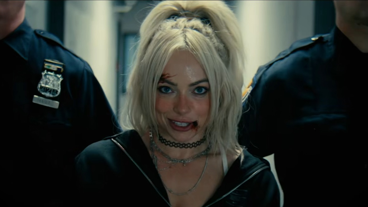 Liv Morgan with bloody on her lips in a scene where she gets arrested by cops from Trouble music video