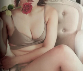 Utami Hayashishita looking insanely hot in a tight grey bikini, seductively holding a rose to her lips in the steamy Marigold Fanbook May 2024 gravure photoshoot